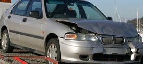wrecked_car_on_flatbed_truck